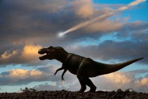 Rappresentazione di un dinosauro e dell'asteroide che si crede abbia portato all'estinzione della sua specie